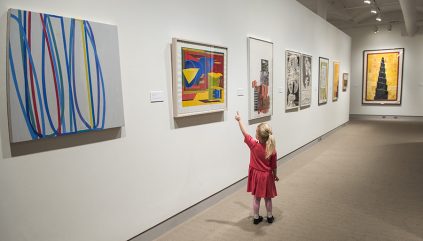 A child pointing at a print in the Zillman's galleries